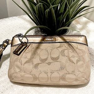 Coach metallic and cream jacquard wristlet with leather trim